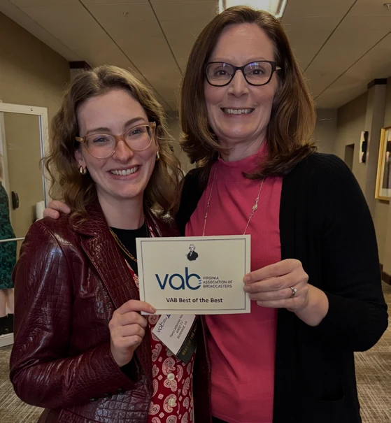 Sonja Morrell and MaryCatherine Price smile while holding a Virginia Association of Broadcasters Best of the Best award.